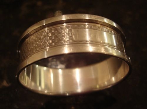 birmingham 1950 sterling silver napkin ring with all over engraving and vacant cartouche