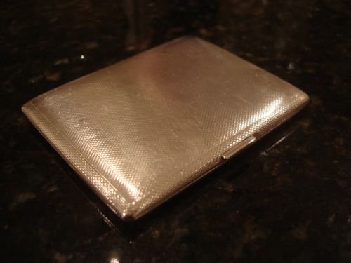 london 1935 solid silver heavy cigarette case with all over engraving made by sj rose and son