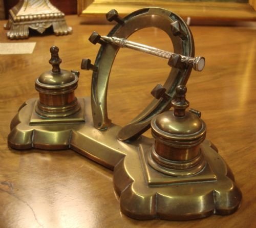 19th century victorian brass inkstand and pen rest in the form of two inkwells and a horseshoe