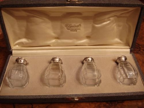 circa 1930 set of 4 first standard solid silver and cut glass salts and peppers in the original fitted case