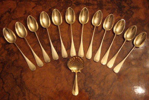 circa 1840 beautiful set of 12 french solid silver gilt teaspoons and matching tea caddy spoon made by renowned maker pierre queille of paris and having a very interesting provenance