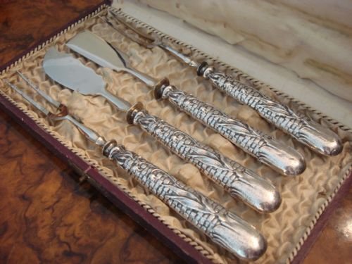 19th century unusual designed cased set of french solid silver handled servers with interesting provenance