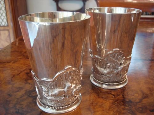 a very unusual pair of victorian silver plated hunting beakers with relief band of game birds