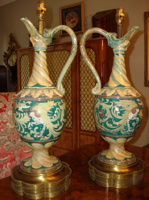 stunning pair of tall 19th century hand painted ceramic lamps in an unusual design