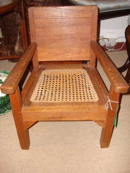 early 20thc childs cane seated solid oak armchair