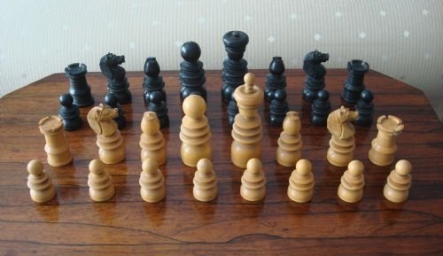 19th century carved and turned boxwood and ebony chess set in mahogany slide top box