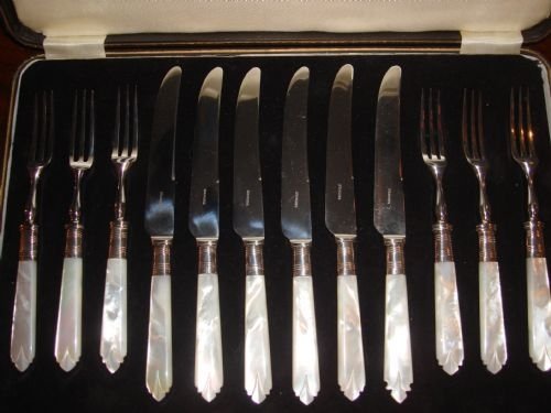 circa 1940's english 12 piece mother of pearl and silverplate handled dessert set of cutlery in fitted case