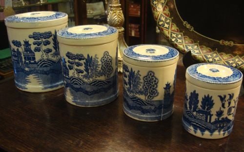 20th century set of 4 graduated china blue and white transfer pattern canisters with lids