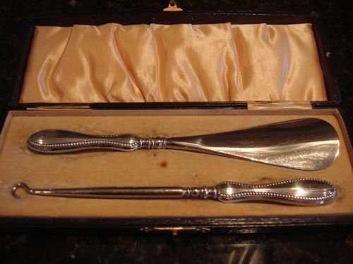 birmingham 1923 solid silver dressing table set comprising shoe horn and button hook in the original case by lionel smith and co